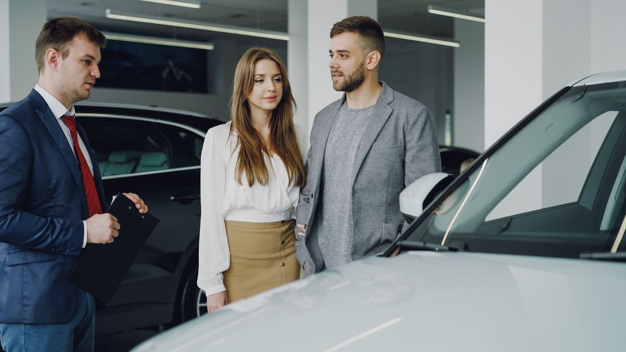 Salesperson showing buyers around the showroom